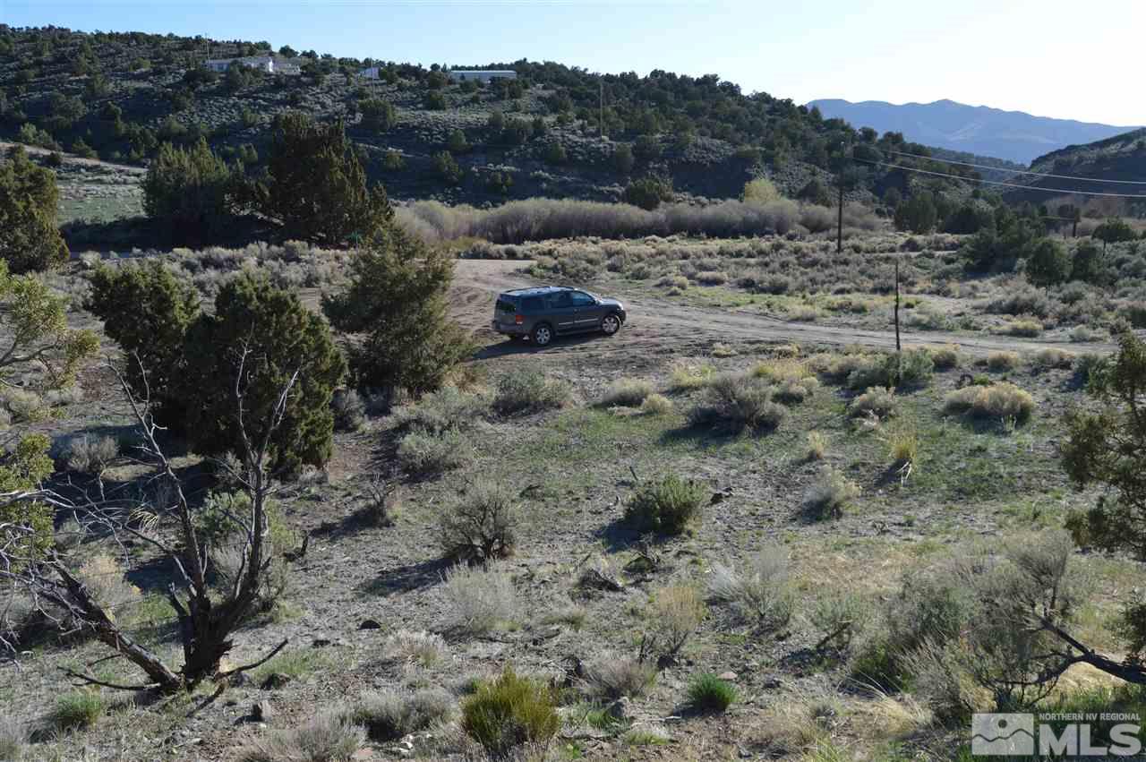 0 Quaking Aspen, Unit 8 Reno, NV 89510 - Photo 13 of 16 a view of a dry field with trees in the background