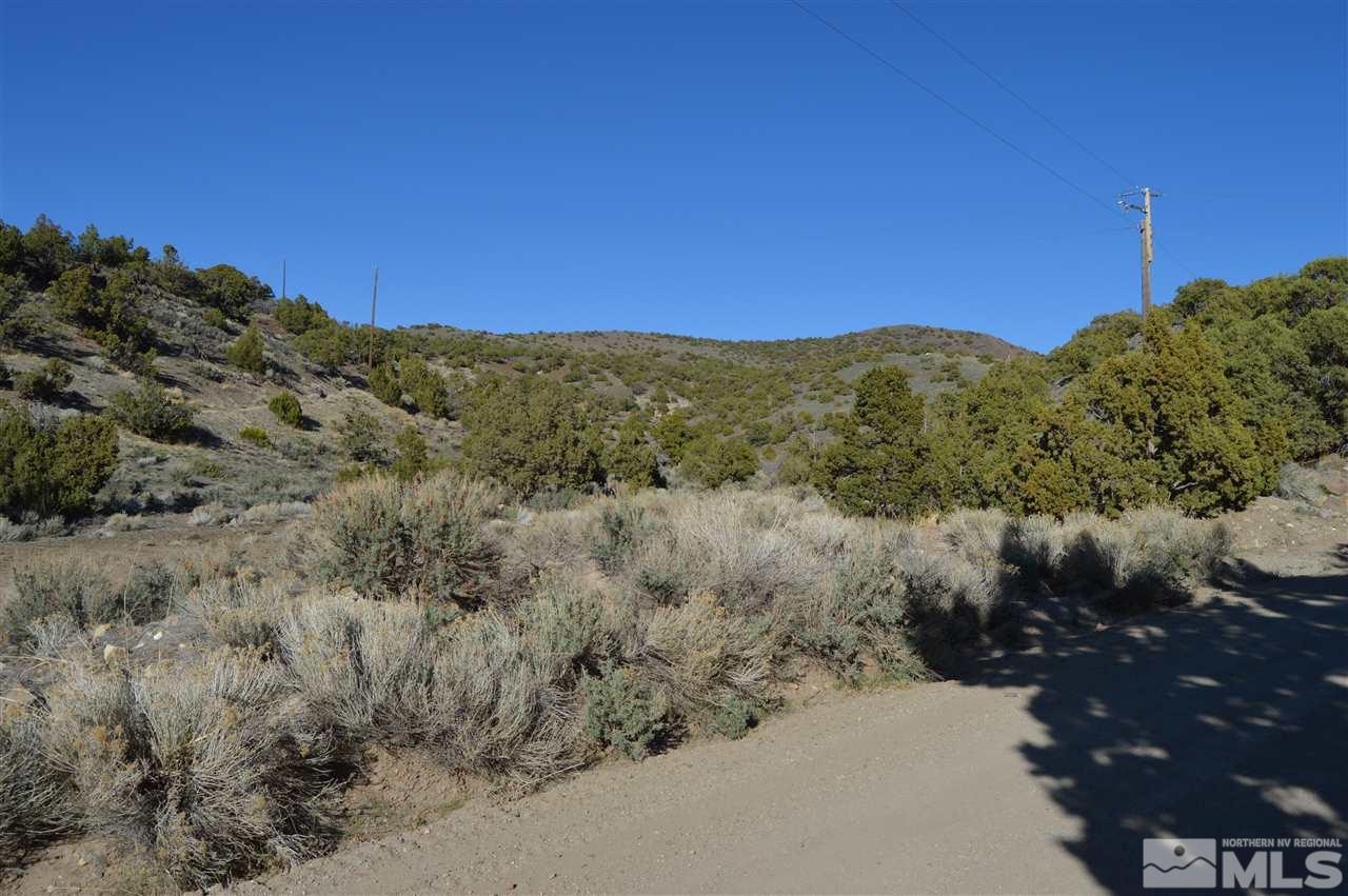 0 Quaking Aspen, Unit 8 Reno, NV 89510 - Photo 6 of 16 a view of a dry yard with mountains in the background