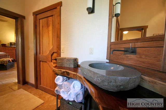 3020 Draft Road Butler, TN 37640 - Photo 4 of 12 a bathroom with a granite countertop sink and a mirror