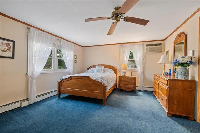 a bedroom with a bed and a baby crib