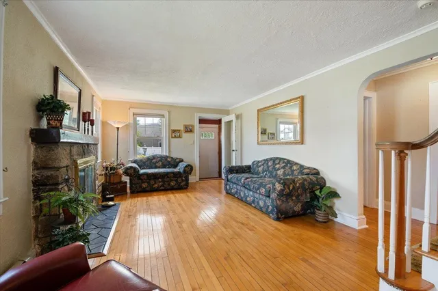 a bedroom with furniture and a fireplace