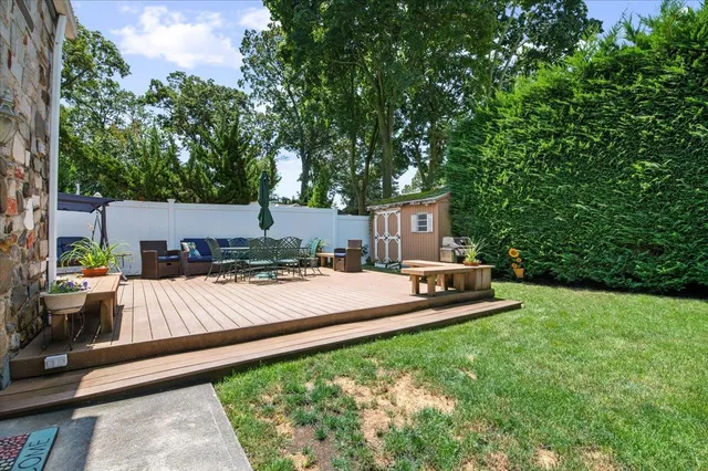 a view of a backyard with a sitting area