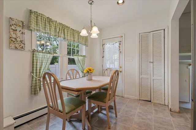 a view of a dining room with furniture window and outside view