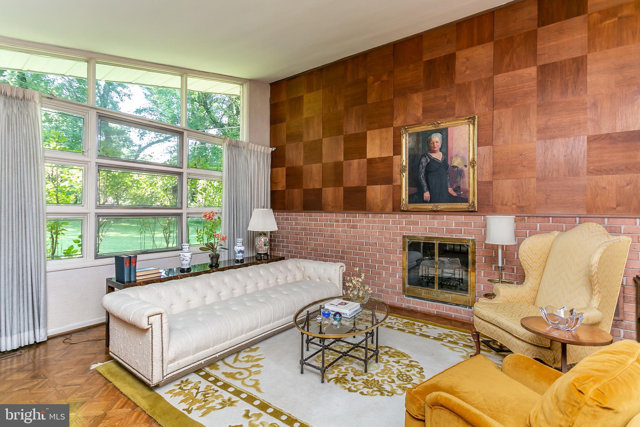 7702 Eden Roc Way Baltimore, MD 21208 - Photo 6 of 37 Living Rm -Light filled w/brick walled fireplace