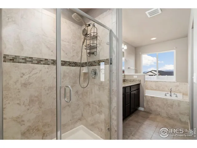 a bathroom with a shower and a sink