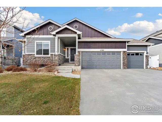 a view of living room with furniture and rug