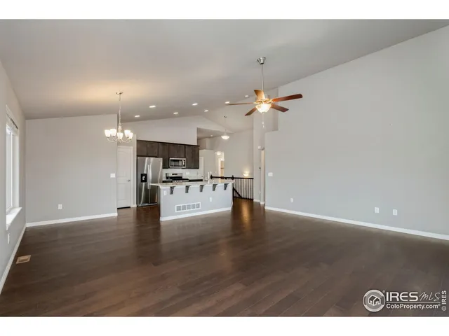 a view of kitchen with furniture and wooden floor