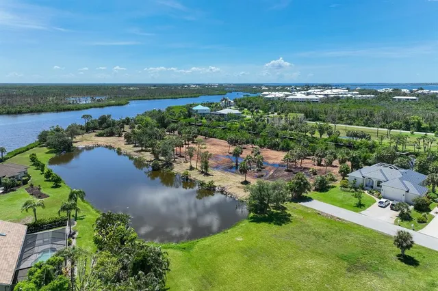 an aerial view of a houses with ocean view