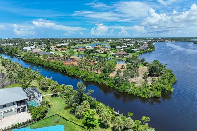 an aerial view of a houses with city view