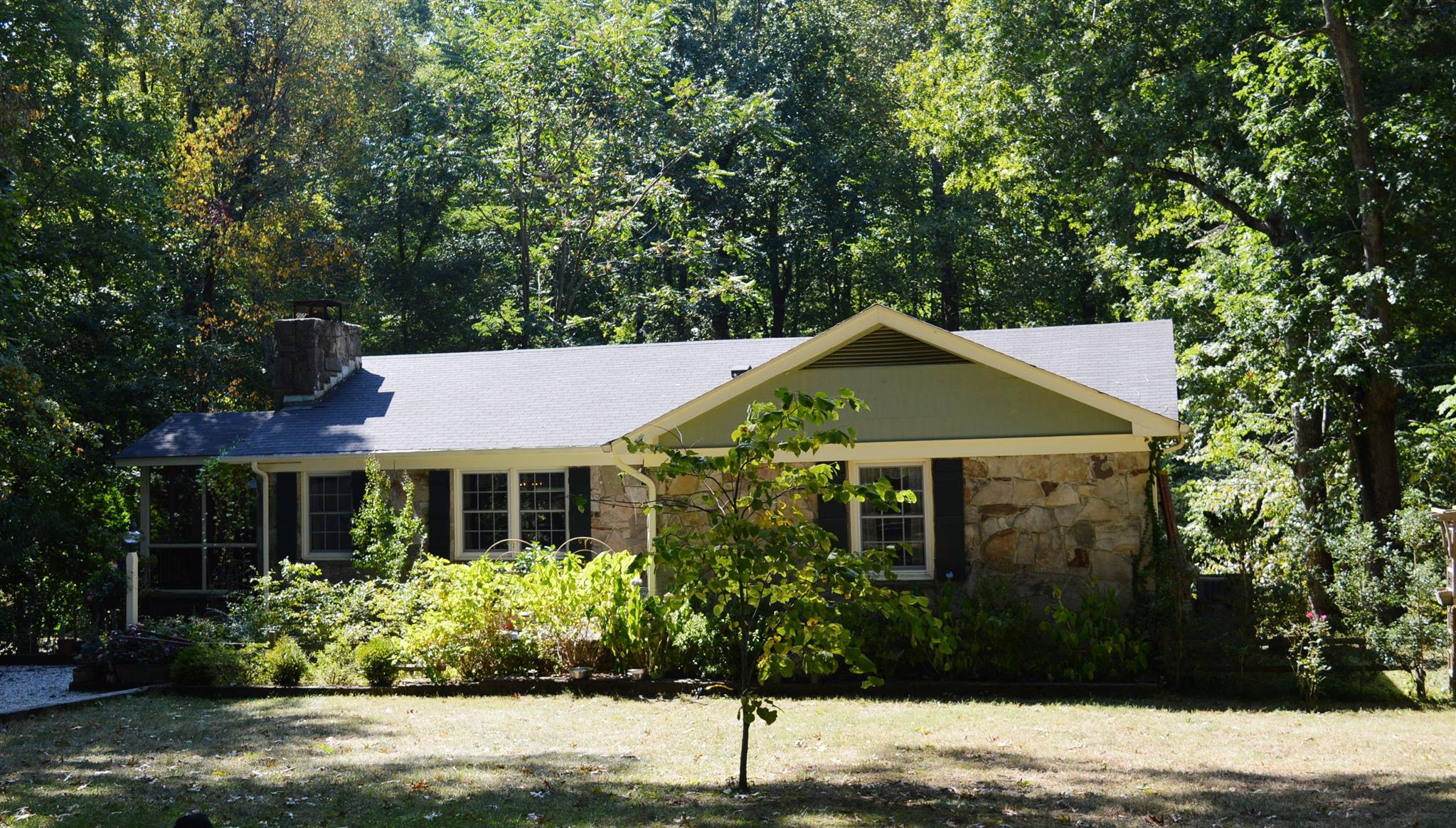 351 Greensview Road Sewanee, TN 37375 - Photo 1 of 13 a front view of a house with a garden