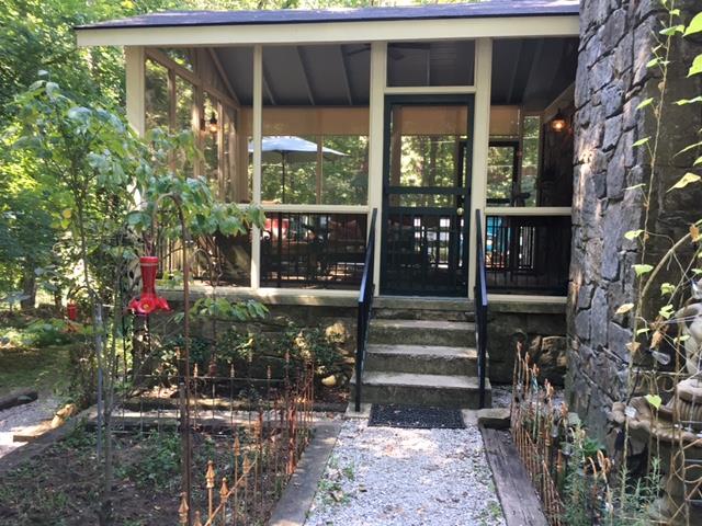 351 Greensview Road Sewanee, TN 37375 - Photo 4 of 13 a front view of a house with a porch