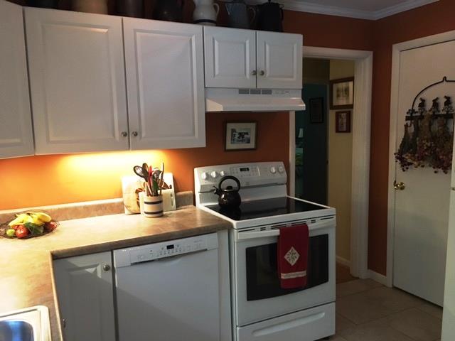 351 Greensview Road Sewanee, TN 37375 - Photo 10 of 13 a kitchen with stainless steel appliances granite countertop a sink stove and refrigerator