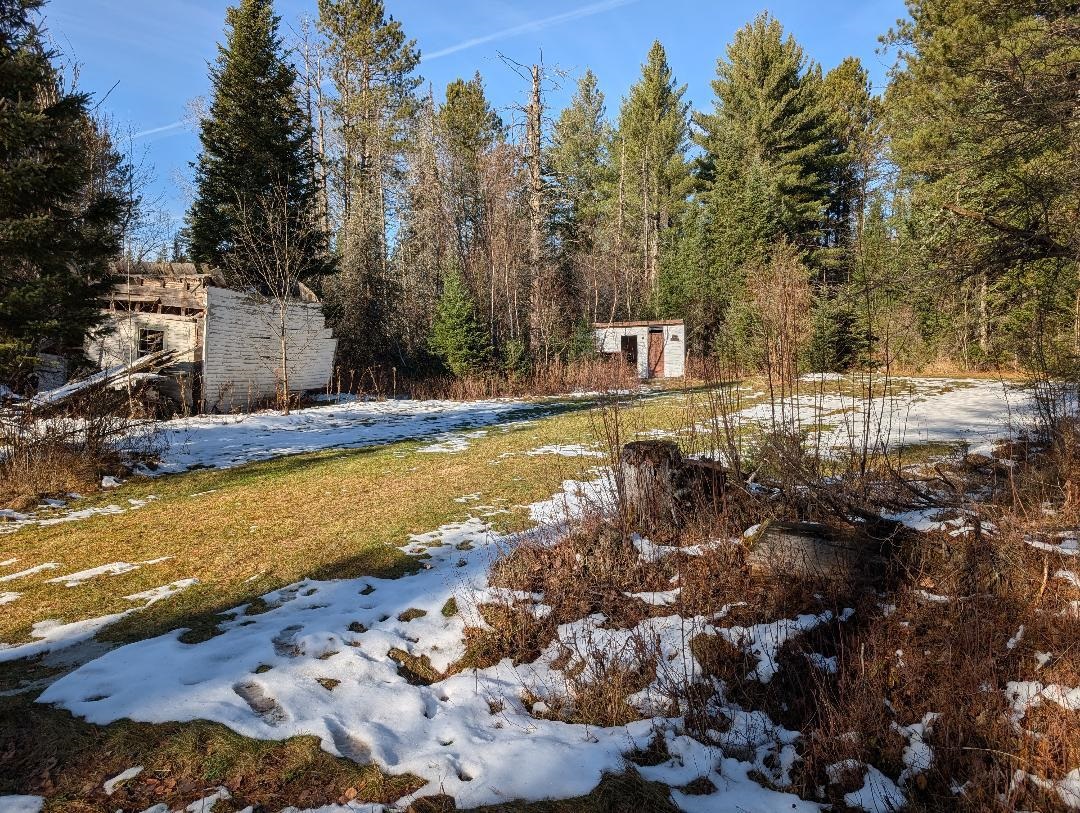 Red House Road Upson, WI 54565 - Photo 17 of 17 Yard layered in snow featuring a shed