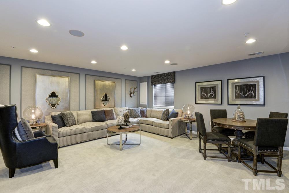 6605 Pathfinder Way Raleigh, NC 27616 - Photo 2 of 3 a living room with furniture and a large window