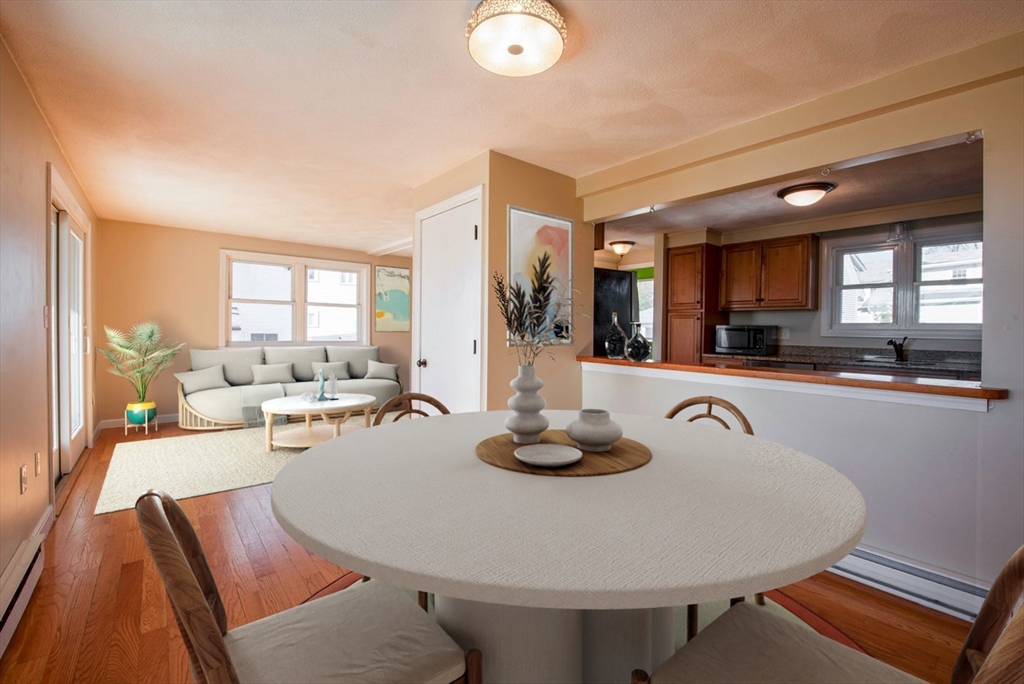 62 Eastern Point Road, Unit 3 Gloucester, MA 01930 - Photo 15 of 27 a living room with furniture and a kitchen