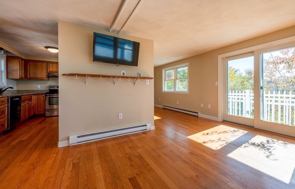62 Eastern Point Road, Unit 3 Gloucester, MA 01930 - Photo 16 of 27 a view of kitchen with wooden floor and a window