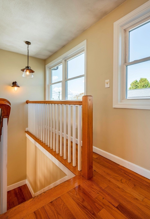 62 Eastern Point Road, Unit 3 Gloucester, MA 01930 - Photo 19 of 27 a view of hallway with a window and wooden floor