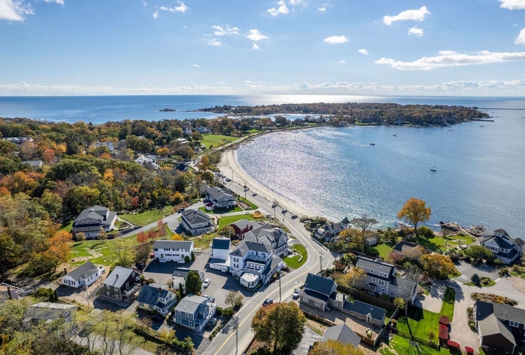 62 Eastern Point Road, Unit 3 Gloucester, MA 01930 - Photo 2 of 27 an aerial view of a house with a swimming pool outdoor seating and yard