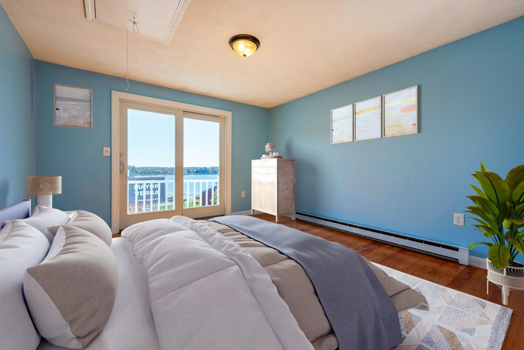 62 Eastern Point Road, Unit 3 Gloucester, MA 01930 - Photo 22 of 27 a bedroom with bed and a window