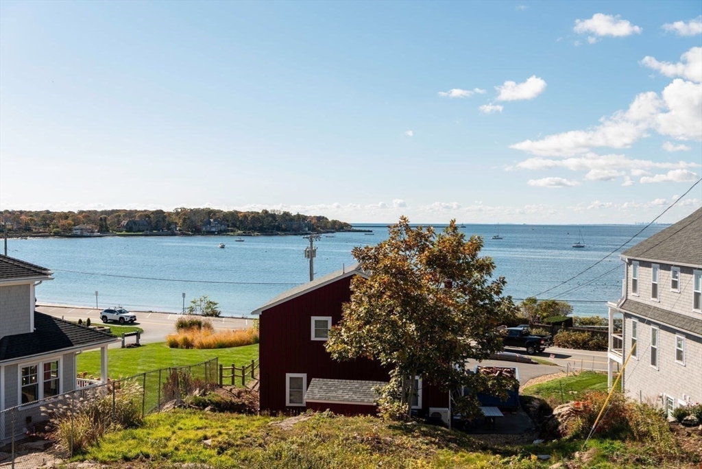 62 Eastern Point Road, Unit 3 Gloucester, MA 01930 - Photo 25 of 27 a view of a lake with a building in the background