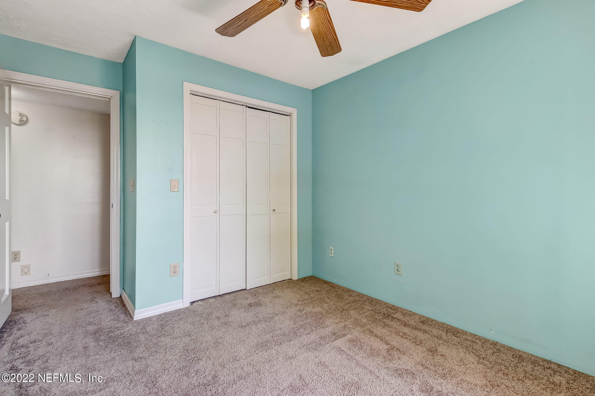 75055 Edwards Road Yulee, FL 32097 - Photo 18 of 34 an empty room with ceiling fan and window