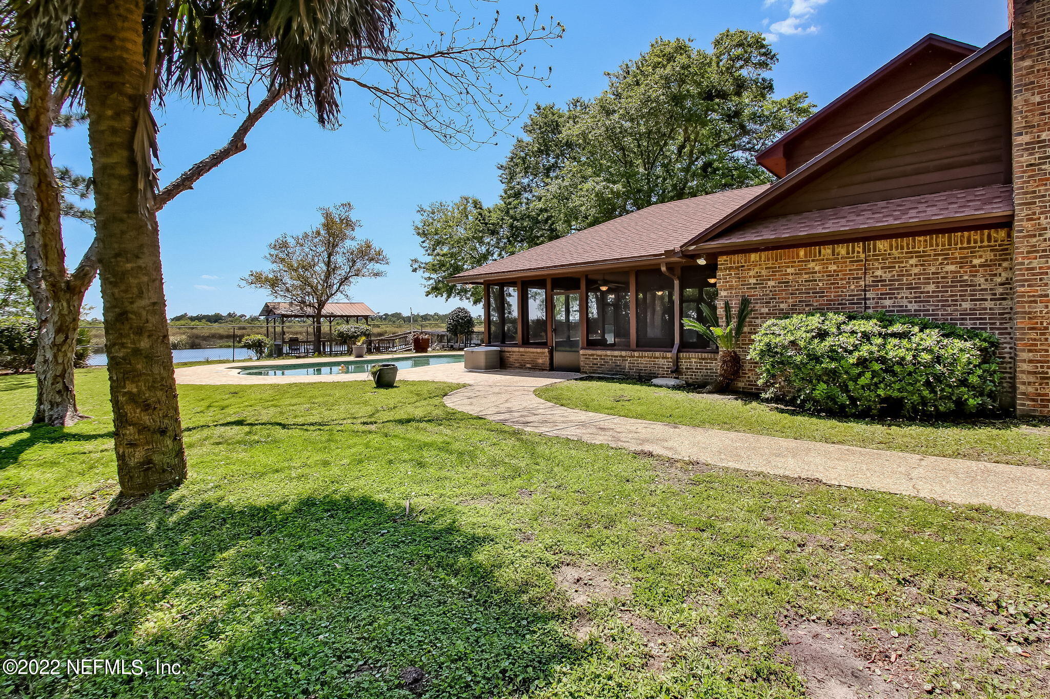 75055 Edwards Road Yulee, FL 32097 - Photo 27 of 34 a view of a house with a yard