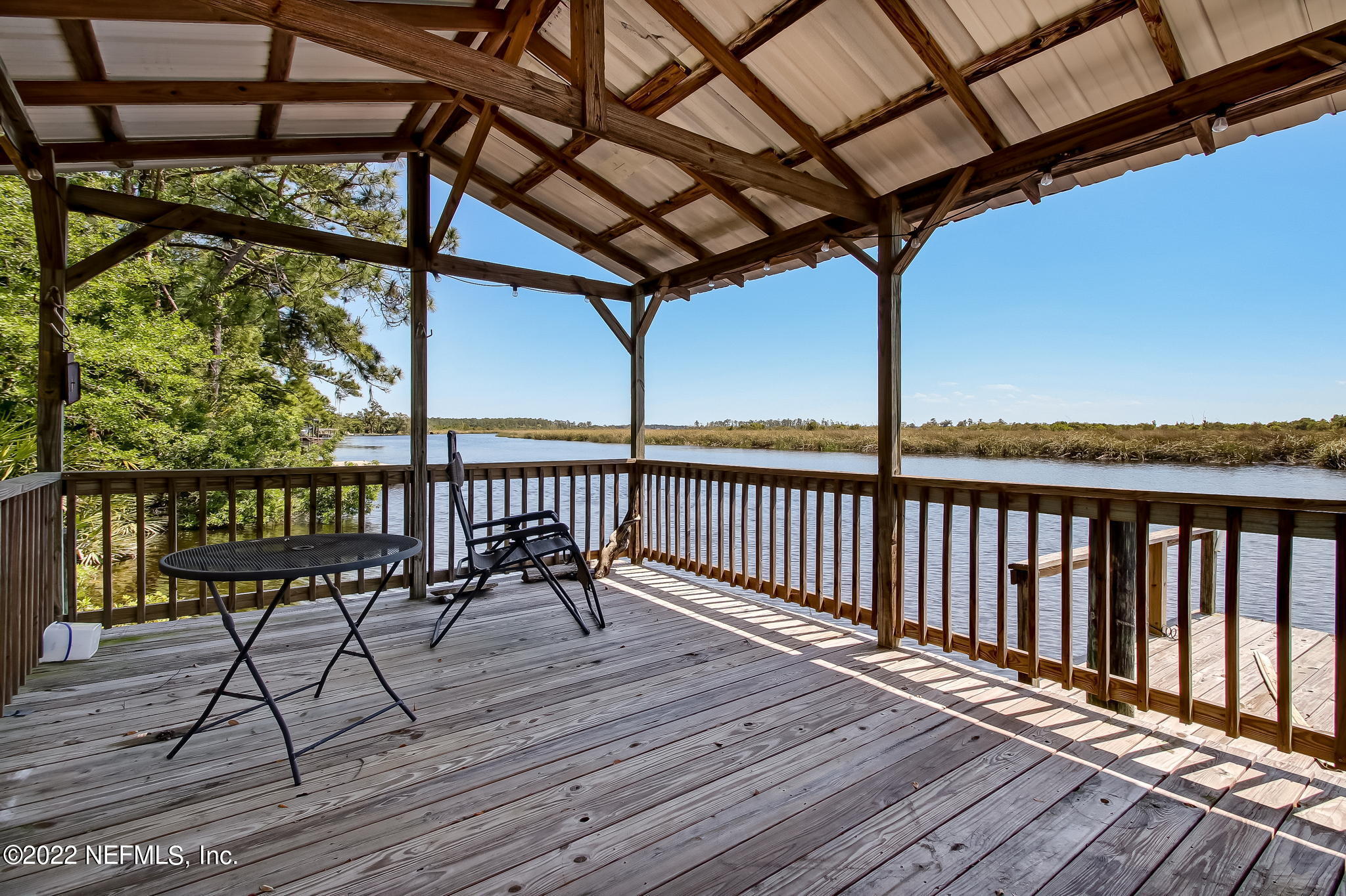 75055 Edwards Road Yulee, FL 32097 - Photo 31 of 34 a view of a chairs on wooden deck