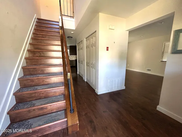 a view of entryway with wooden floor
