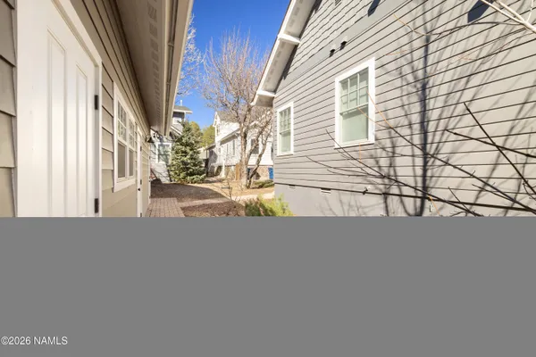 a view of a house with a yard and garage