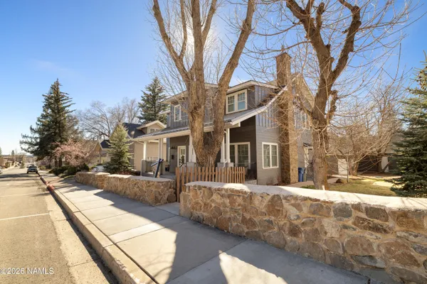 a view of a building with a large tree