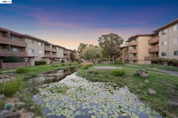 a view of a large building with a yard