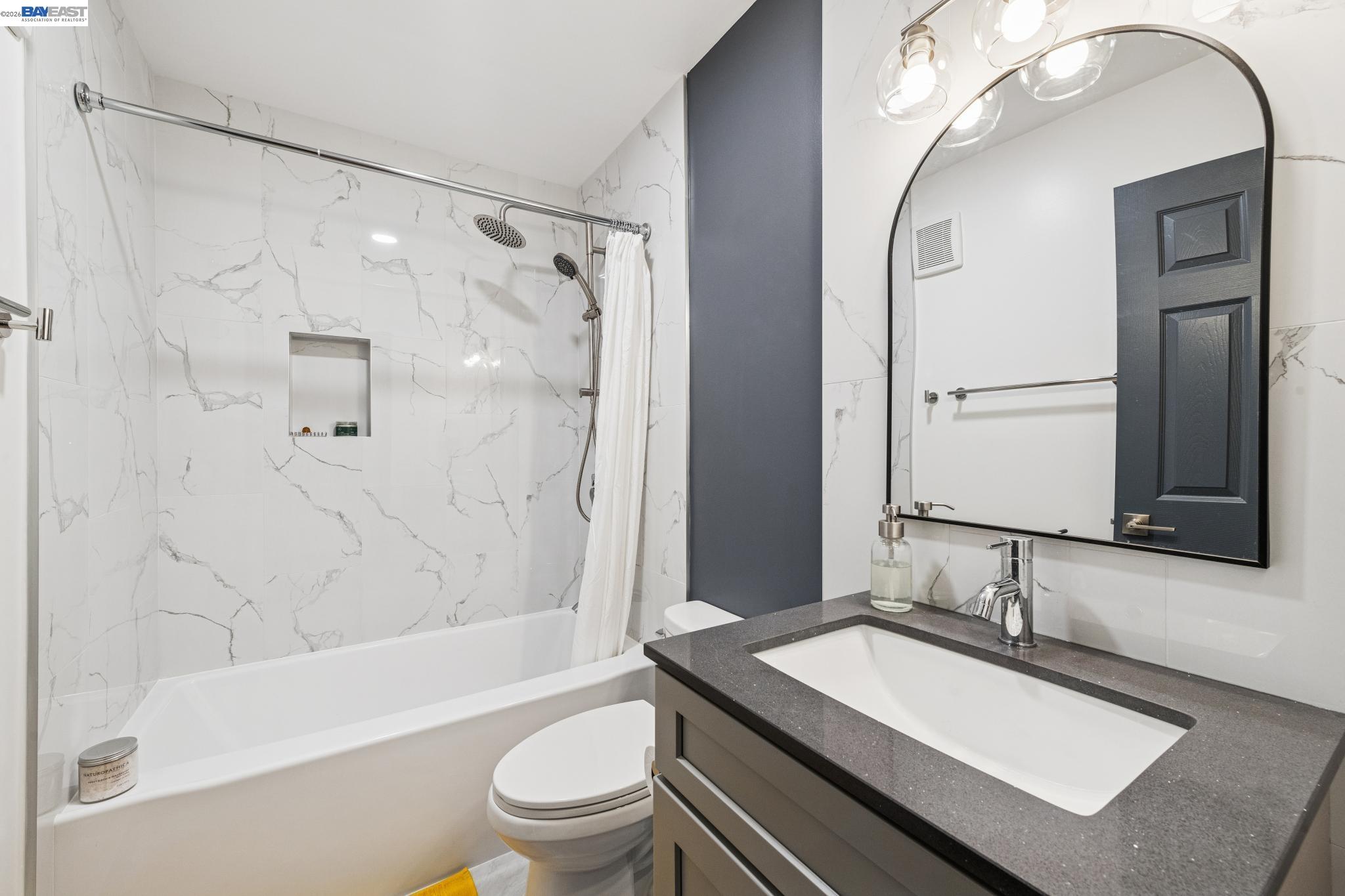 1321 Webster Street, Unit D116 Alameda, CA 94501 - Photo 8 of 22 a bathroom with a sink double vanity mirror and a bathtub