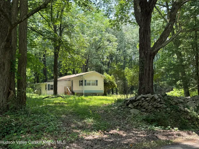 a house with trees in front of it