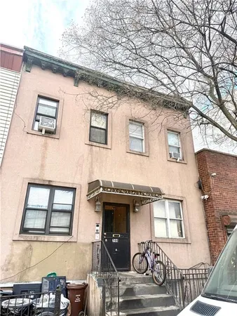 a front view of a house with garage