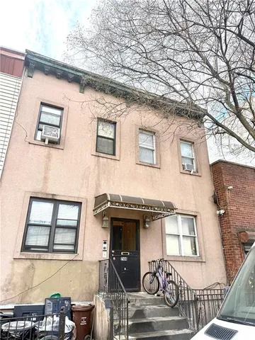 a front view of a house with garage