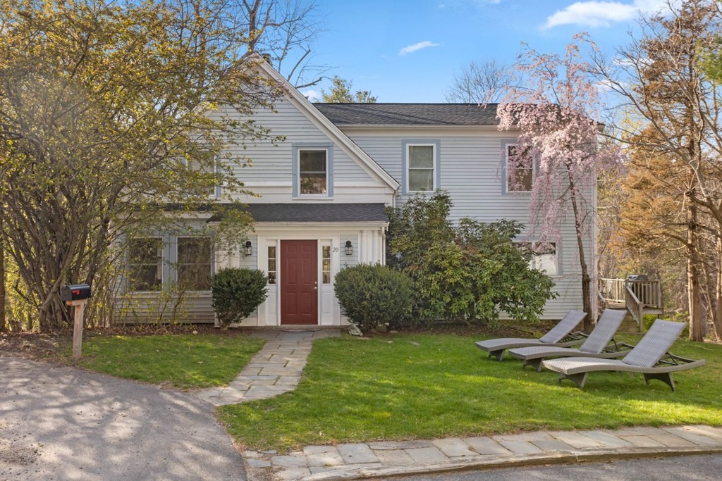20 Gowell Lane Weston, MA 02493 - Photo 1 of 32 a front view of a house with a yard and garage