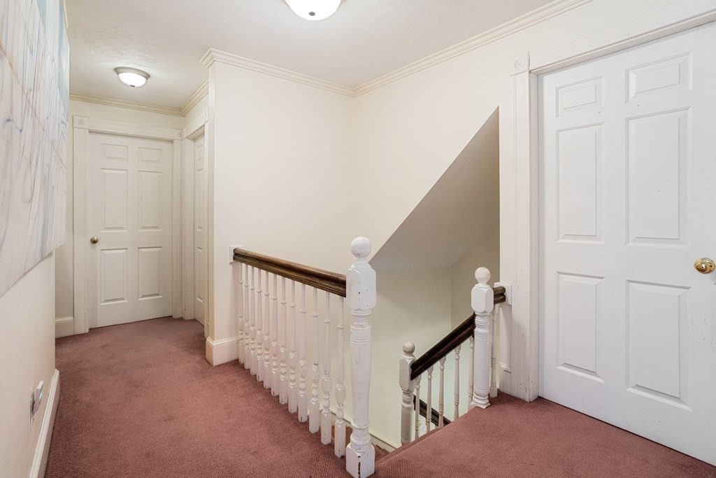 20 Gowell Lane Weston, MA 02493 - Photo 14 of 32 a view of a hallway with staircase