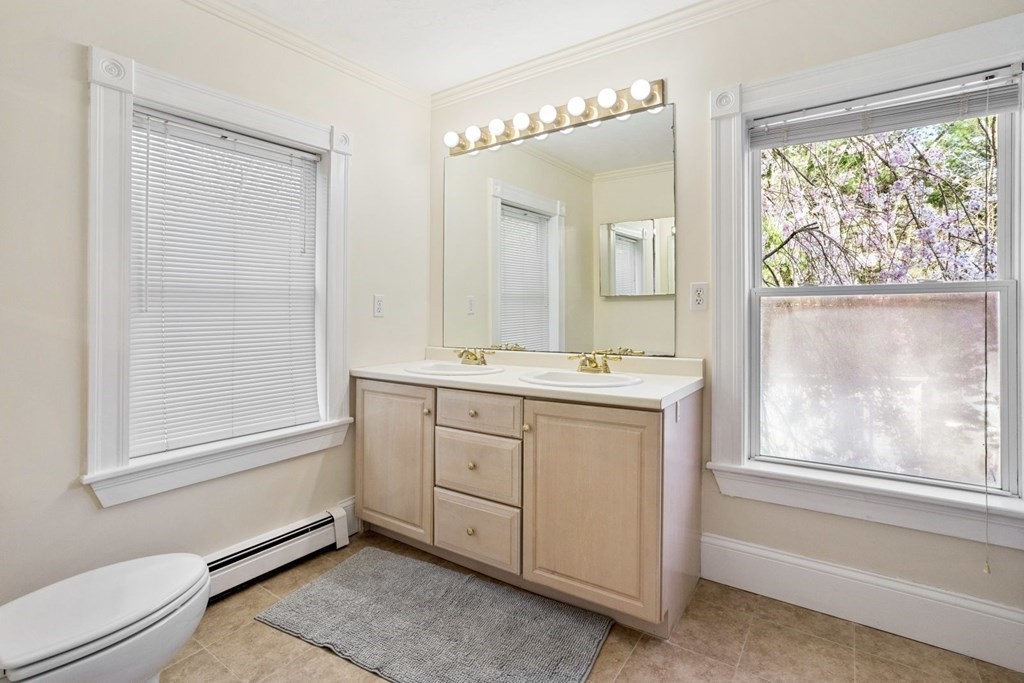 20 Gowell Lane Weston, MA 02493 - Photo 17 of 32 a bathroom with a sink mirror and a bathtub