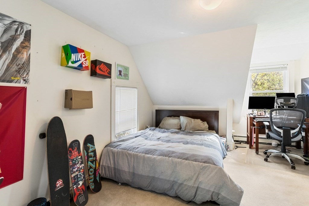 20 Gowell Lane Weston, MA 02493 - Photo 18 of 32 a bedroom with a bed and a chair