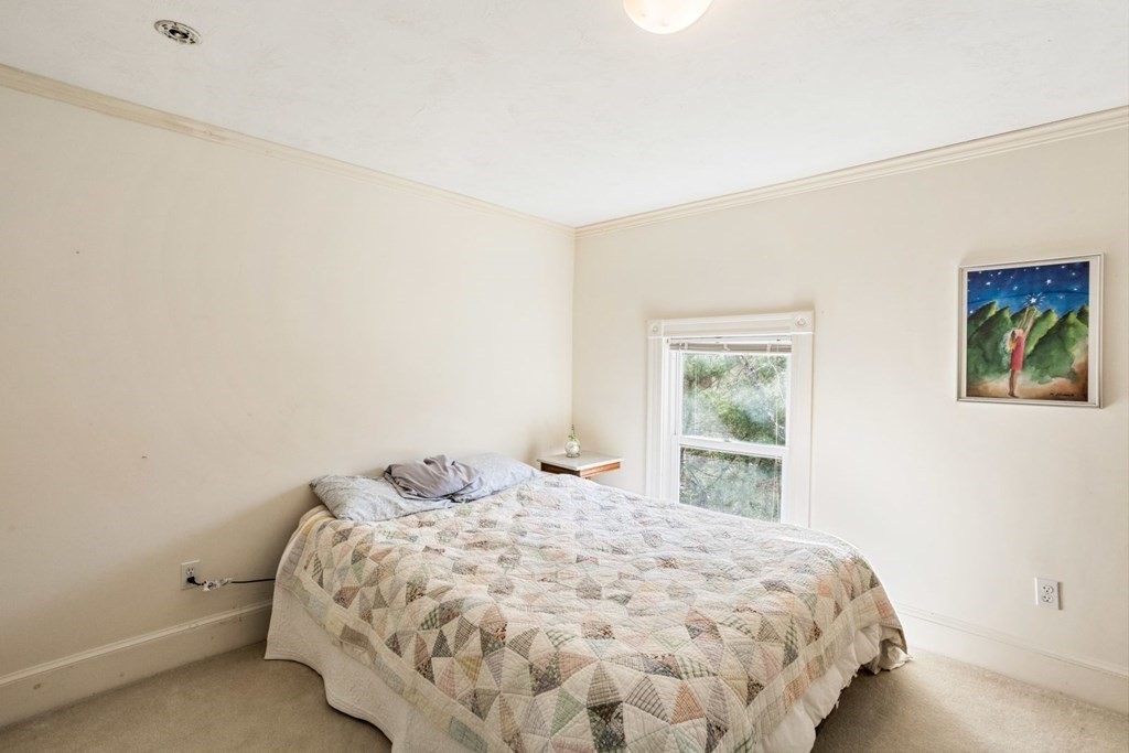 20 Gowell Lane Weston, MA 02493 - Photo 21 of 32 a bedroom with a bed and a window