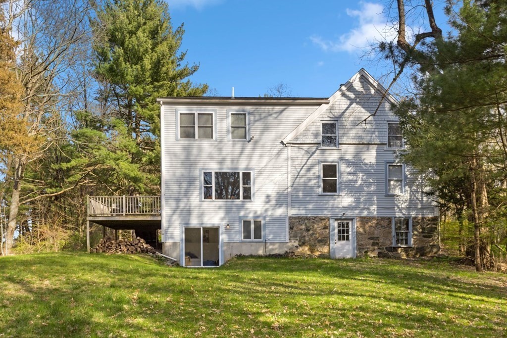 20 Gowell Lane Weston, MA 02493 - Photo 26 of 32 a view of a house with a big yard and large trees