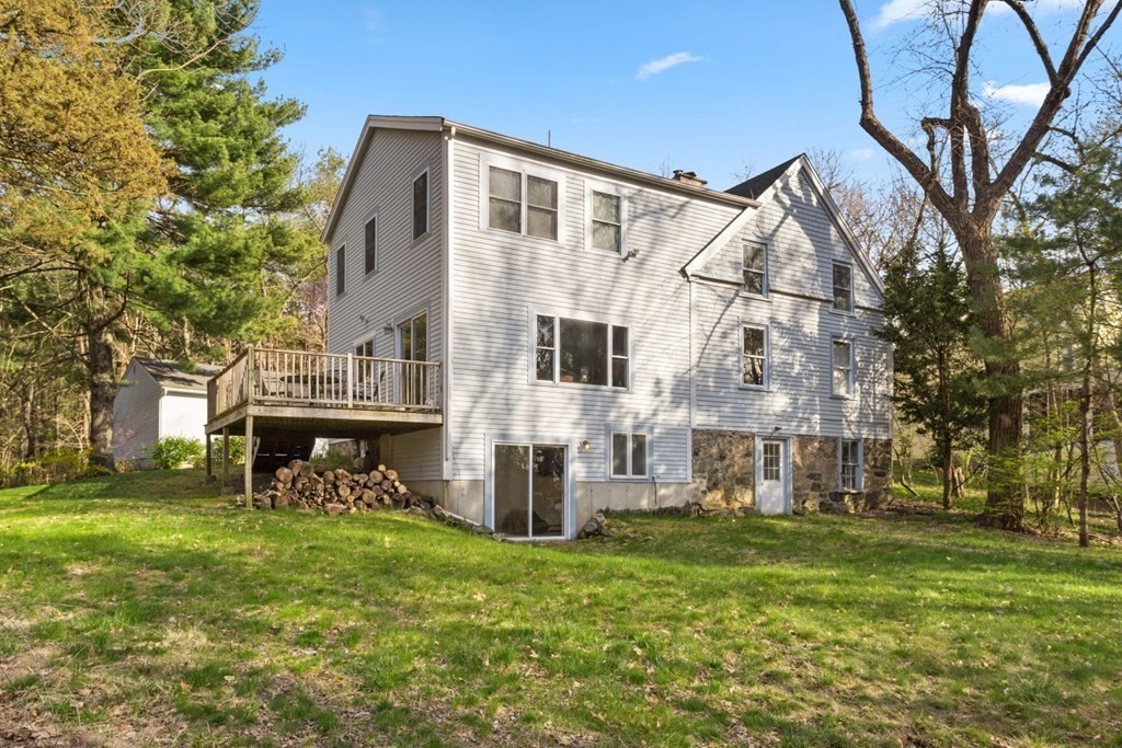20 Gowell Lane Weston, MA 02493 - Photo 27 of 32 a view of a house with a yard