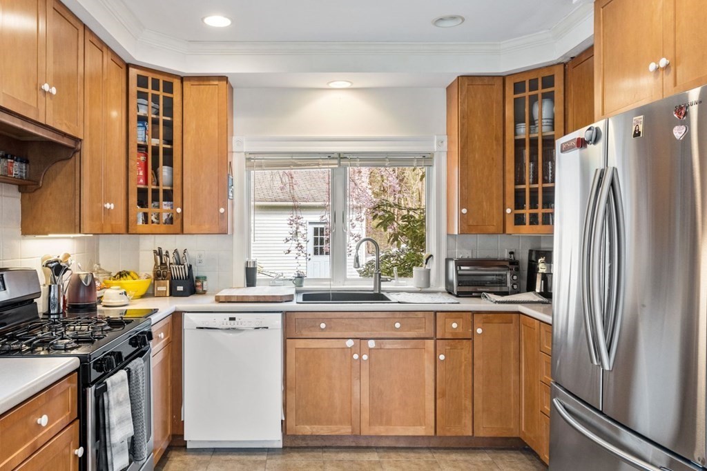 20 Gowell Lane Weston, MA 02493 - Photo 5 of 32 a kitchen with a sink stove and refrigerator