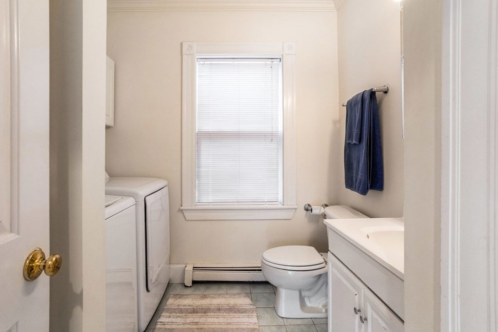 20 Gowell Lane Weston, MA 02493 - Photo 7 of 32 a bathroom with a toilet sink and mirror
