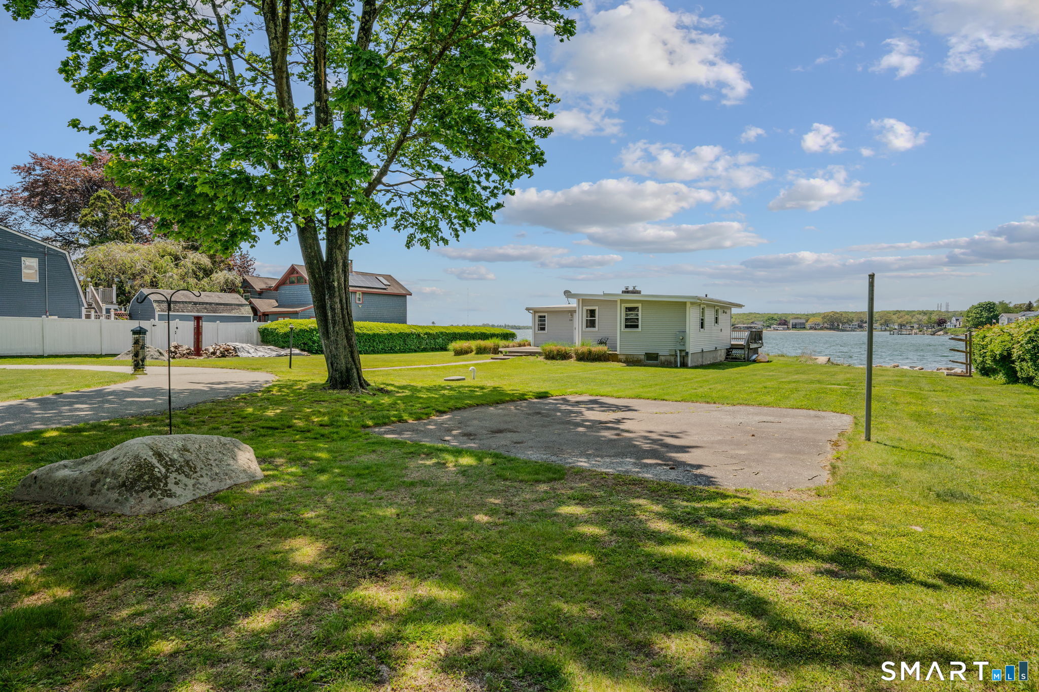 210 Shore Road Waterford, CT 06385 - Photo 3 of 26 a view of yard with swimming pool and green space