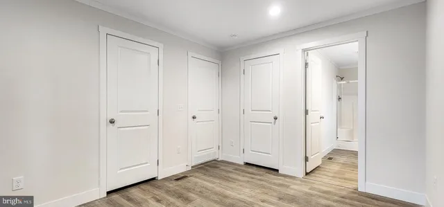 a view of an empty room and wooden floor