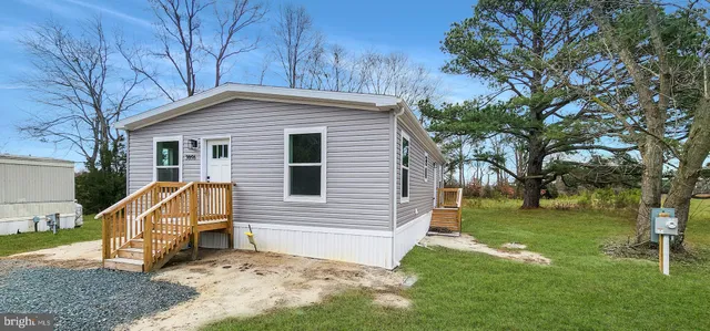 a view of backyard with a garden and entertaining space