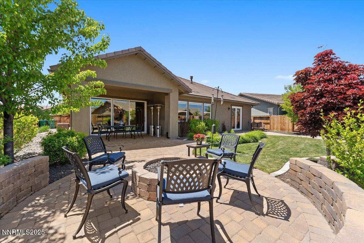 9822 Dyevera Lane Reno, NV 89521 - Photo 40 of 44 a view of a patio with table and chairs and potted plants