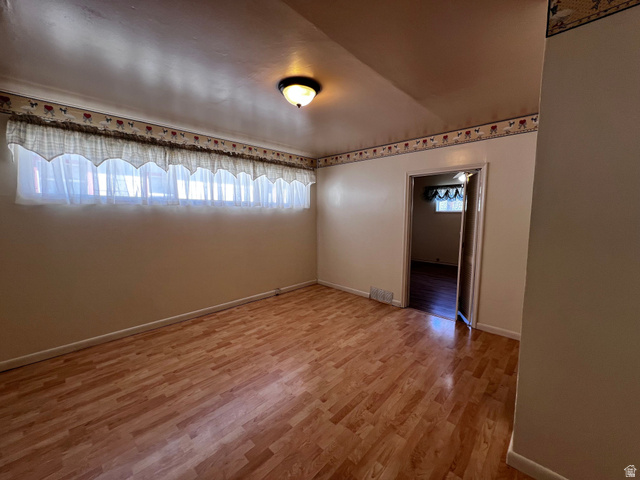 338 South 300 West Helper, UT 84526 - Photo 14 of 20 Empty room with light wood finished floors and baseboards
