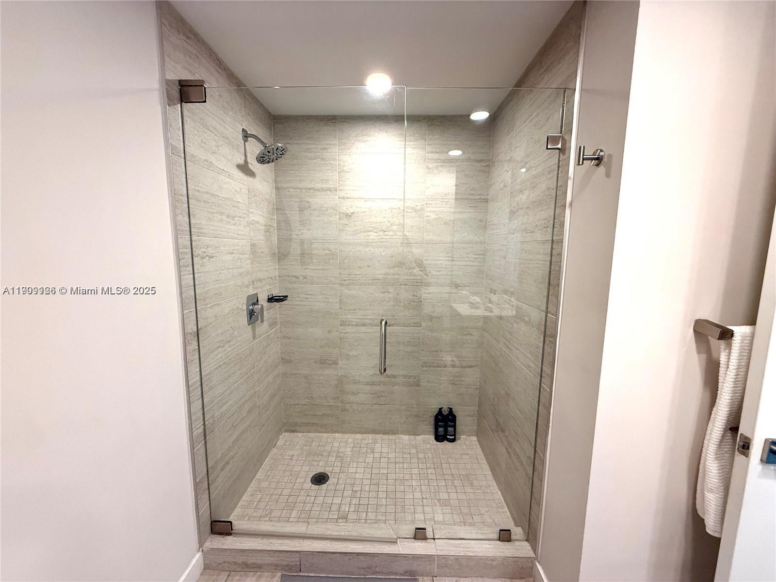 3900 Biscayne Boulevard, Unit N723 Miami, FL 33137 - Photo 16 of 30 a bathroom with a shower and a sink